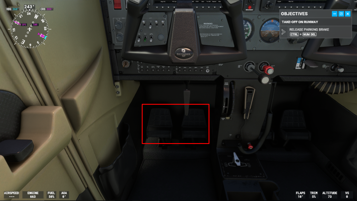 View of cockpit highlighting the rudder pedals underneath the joystick.